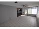 Bright sunroom featuring tiled floors and multiple windows overlooking the outdoor space at 3544 Wilson Dr, Holiday, FL 34691