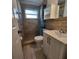 Bathroom featuring a walk-in shower and updated fixtures at 8535 Bella Via, Hudson, FL 34667