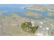 Aerial view highlighting waterfront lot boundaries at 8812 Camp Ln, Hudson, FL 34667