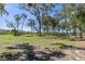 Large waterfront lot with mature trees and grassy areas at 8812 Camp Ln, Hudson, FL 34667