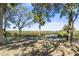 Spacious backyard with mature trees and a waterfront view at 8812 Camp Ln, Hudson, FL 34667