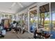 Spacious screened porch with access to backyard and water views at 8812 Camp Ln, Hudson, FL 34667