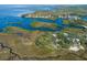 Aerial view of waterfront property with lush vegetation at 8812 Camp Ln, Hudson, FL 34667