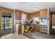 Kitchen with wood cabinets and appliances needing updating at 8812 Camp Ln, Hudson, FL 34667