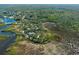 Aerial view of property with lush landscape and waterfront access at 8812 Camp Ln, Hudson, FL 34667