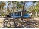 Charming waterfront cottage nestled on a shaded lot with mature trees at 8812 Camp Ln, Hudson, FL 34667