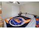 Bedroom with double doors and ceiling fan at 12233 Pitcairn St, Brooksville, FL 34613