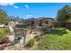 Landscaped backyard with fire pit and patio, offering a relaxing space at 12233 Pitcairn St, Brooksville, FL 34613