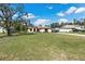 House with a large yard and driveway at 12233 Pitcairn St, Brooksville, FL 34613