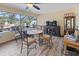 Sunroom with table and chairs, overlooking backyard at 12233 Pitcairn St, Brooksville, FL 34613