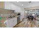 Well-equipped kitchen featuring white cabinets and granite countertops at 12233 Pitcairn St, Brooksville, FL 34613