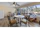 Sunroom with rocking chairs and view of the pool at 12233 Pitcairn St, Brooksville, FL 34613