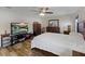 Bright bedroom with king-size bed and flat-screen TV at 12233 Pitcairn St, Brooksville, FL 34613