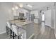 Modern kitchen with granite countertops and breakfast bar at 12847 Solola Way, Trinity, FL 34655