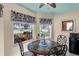 Bright breakfast nook with three windows and a round table at 13215 Golf Ridge Pl, Hudson, FL 34669