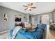 Living room with blue sectional sofa and view of entryway at 647 Wilsford Ln, Spring Hill, FL 34609