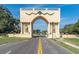 Ornate archway entrance to community with globe feature at 2209 Utopian E Dr # 109, Clearwater, FL 33763