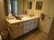 Bathroom with vanity, sink, and tiled floor at 3968 Sailmaker Ln # 3968, Holiday, FL 34691