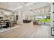 Bright dining room with a large table and chandelier, open to living area at 6406 Summit View Dr, Brooksville, FL 34601