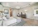 Spacious main bedroom with a king-size bed and access to patio at 6406 Summit View Dr, Brooksville, FL 34601
