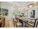 Open concept dining room with view to living area and backyard at 6406 Summit View Dr, Brooksville, FL 34601