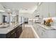 Modern kitchen with expansive island and white cabinets at 6406 Summit View Dr, Brooksville, FL 34601