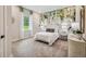 Serene bedroom featuring a leafy wall mural and window at 6406 Summit View Dr, Brooksville, FL 34601
