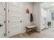 Convenient laundry room with built-in cabinets and bench at 6406 Summit View Dr, Brooksville, FL 34601