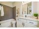 Modern bathroom with a herringbone tile shower and white vanity at 6406 Summit View Dr, Brooksville, FL 34601