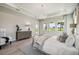 Spacious main bedroom with large windows and a dresser at 6406 Summit View Dr, Brooksville, FL 34601