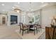 Bright dining room features a large chandelier and seating for six at 6406 Summit View Dr, Brooksville, FL 34601