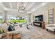 Living room showcasing a sectional sofa, sliding glass doors and a view at 6406 Summit View Dr, Brooksville, FL 34601
