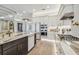 Modern kitchen with white cabinets, marble countertops, and high-end appliances at 6406 Summit View Dr, Brooksville, FL 34601