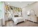 Charming bedroom with a leafy wall mural and a dresser at 6406 Summit View Dr, Brooksville, FL 34601