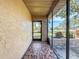 Tiled entryway featuring large windows letting in ample light at 10824 Peppertree Ln, Port Richey, FL 34668