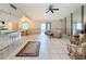 Open living space with tile floors connects to kitchen and dining areas at 10824 Peppertree Ln, Port Richey, FL 34668