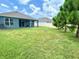 An expansive backyard with green lawn and fence is ideal for outdoor enjoyment at 13447 Newport Shores Dr, Hudson, FL 34669