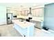 Bright kitchen features stainless steel appliances and a central island at 13447 Newport Shores Dr, Hudson, FL 34669
