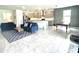 Open floor plan features living room and modern kitchen with stainless appliances at 13447 Newport Shores Dr, Hudson, FL 34669