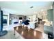 Open floor plan showcasing living room with fireplace, kitchen and a dining area at 13447 Newport Shores Dr, Hudson, FL 34669