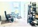 Office space featuring a large window, desk, shelves, and room for extra seating at 13447 Newport Shores Dr, Hudson, FL 34669