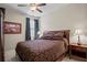 Spacious bedroom with a king-size bed and ceiling fan at 19504 Lily Pond St, Brooksville, FL 34601