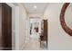 Elegant hallway with tile flooring, antique furniture, and views to another room at 19504 Lily Pond St, Brooksville, FL 34601