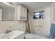 Clean bathroom with a tub, shower, and white vanity at 3423 Umber Rd, Holiday, FL 34691