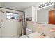 Clean bathroom with shower, vanity, and overhead lighting at 3423 Umber Rd, Holiday, FL 34691
