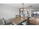Dining room with gray table and chairs near kitchen at 3423 Umber Rd, Holiday, FL 34691