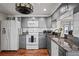 Modern gray kitchen with granite countertops and wood floors at 3423 Umber Rd, Holiday, FL 34691