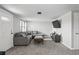 Living room with gray sectional sofa and wood coffee table at 3423 Umber Rd, Holiday, FL 34691