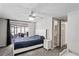 Main bedroom with a comfortable bed and en-suite bathroom at 3423 Umber Rd, Holiday, FL 34691