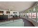 Spacious sunroom with comfortable seating and pool access at 3423 Umber Rd, Holiday, FL 34691